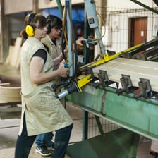 A craftsperson demonstrating a skilled manual task