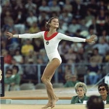 Olga Korbut performing gymnastics in an archival Olympic image