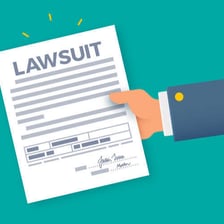 A person submitting legal documents at a courthouse.