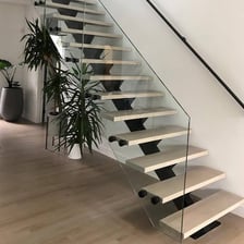 A close view of one stair in a staircase.