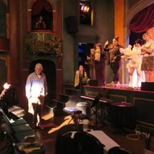 Actors practicing a performance during a dress rehearsal