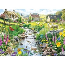 Small stream flowing through a rural landscape