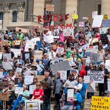 A crowd making a forceful public protest.