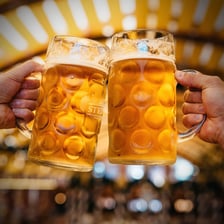 A large decorated beer mug associated with Oktoberfest.