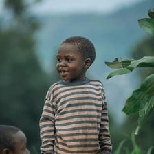 A young boy standing outdoors