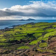 A lush green Irish landscape representing the Emerald Isle