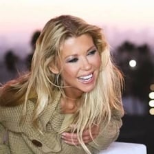 A portrait of actress Tara Reid.