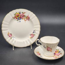 Delicate porcelain tableware displayed together.