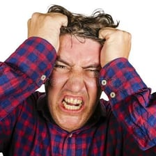 A visibly frustrated and flustered person.