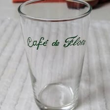 A glass of water in a French café setting