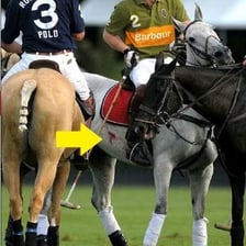 A horseback rider wearing a spur.
