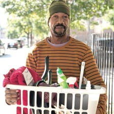 A person improvising a solution with limited household supplies.