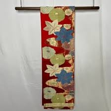 Colorful obi sashes displayed with Japanese kimono.