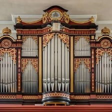 A large pipe organ installed inside a church.