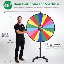A person giving a spinning carnival game a try.