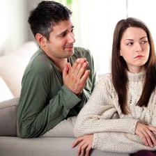 A person making an apologetic gesture