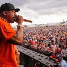 LL Cool J performing onstage at a concert.