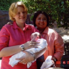 An adoptive parent and child together during an adoption-related moment.