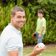 Children tossing a baseball back and forth