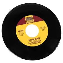A collection of vinyl records associated with classic popular songs.