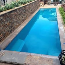 A swimming pool divided into marked lanes for lap swimming.
