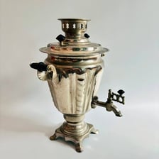An ornate metal samovar used as a tea urn