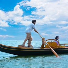 A rowing oar resting in a boat
