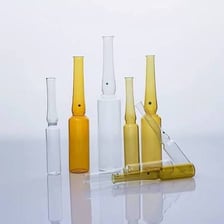 A small sealed glass ampule containing liquid medicine