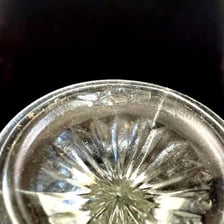 A close view of the outer rim of a solid object.
