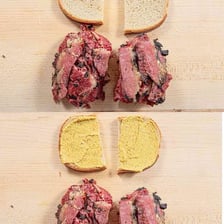 Slices of rye bread beside a deli sandwich
