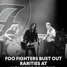 Foo Fighters performing onstage at a concert.