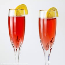 A kir cocktail made with white wine and dark berry liqueur.