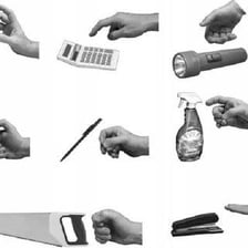 A hand grasping and taking hold of an object.
