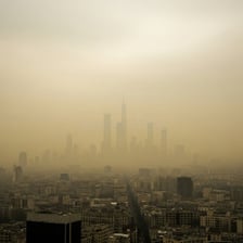 A city skyline obscured by a layer of smog.