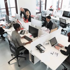 A temporary office worker seated at a desk.