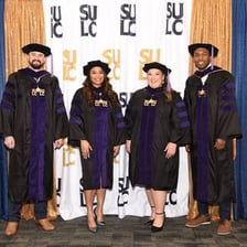 Law graduates wearing academic regalia at a graduation ceremony