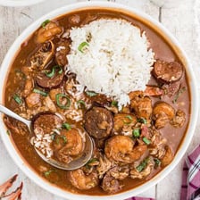A table of Louisiana Cajun dishes including gumbo