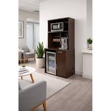 An office break room with a coffee maker and refreshment area.