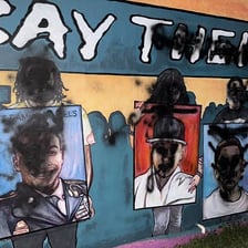 A wall with its surface marred by graffiti