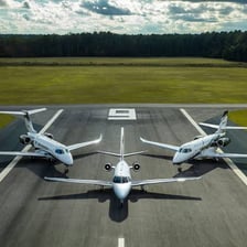A Cessna Citation business jet on an airport runway.