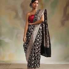 A person wearing a traditional Indian sari.