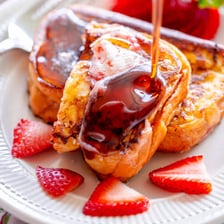 Toast topped with a layer of fruit jam.
