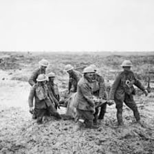 Soldiers marching in a line with visible spaces between them.