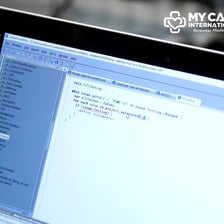 A person working on website management at a computer.