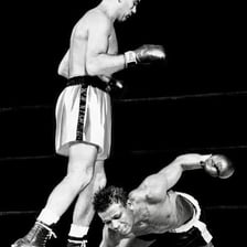 Two boxers facing each other before a fight