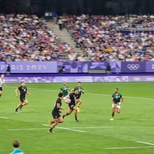 Players competing in a rugby sevens match.