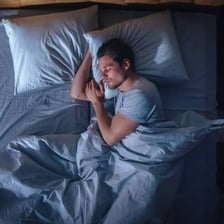 A tired person asleep after a long day.