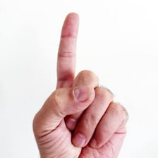 An index finger pointing toward an appropriate choice