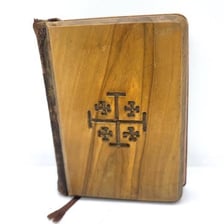 A vintage scene representing the 1950s beside a New Testament book