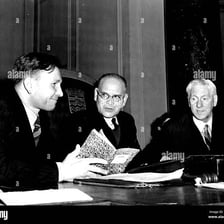 A secretary taking part in a conference discussion.